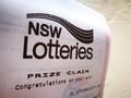 New South Wales lotteries Prize claim paper says Congratulations on your win on white paper.